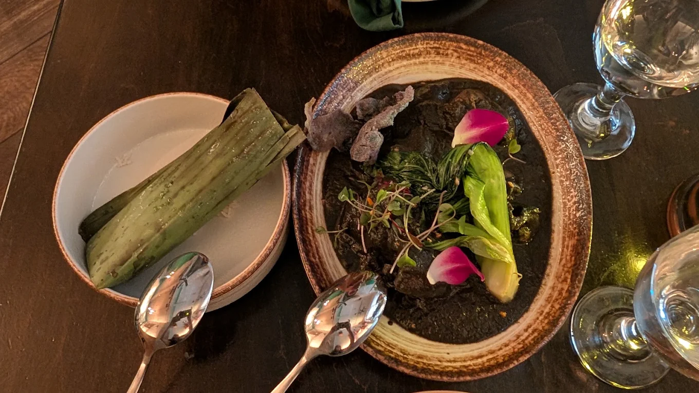 Black Sesame Heritage — black sesame chicken curry with banana leaf-wrapped sticky rice