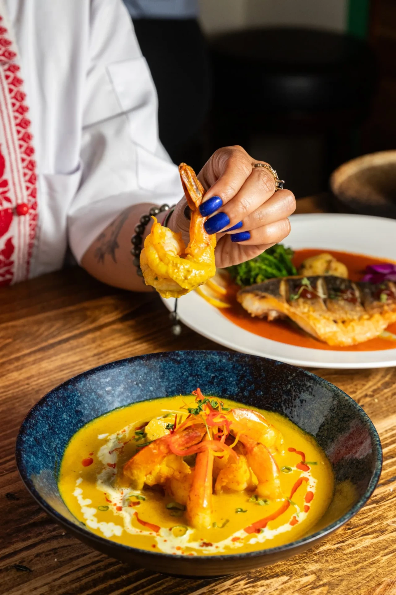 Golden Coconut Curry — shrimp in a silky golden coconut curry with cream swirls and chilli oil