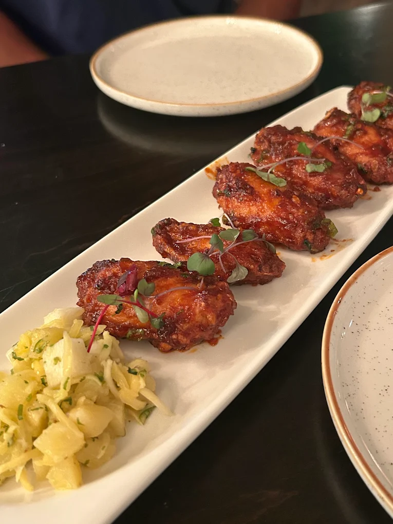 Bamboo Blaze glazed chicken wings on a long platter